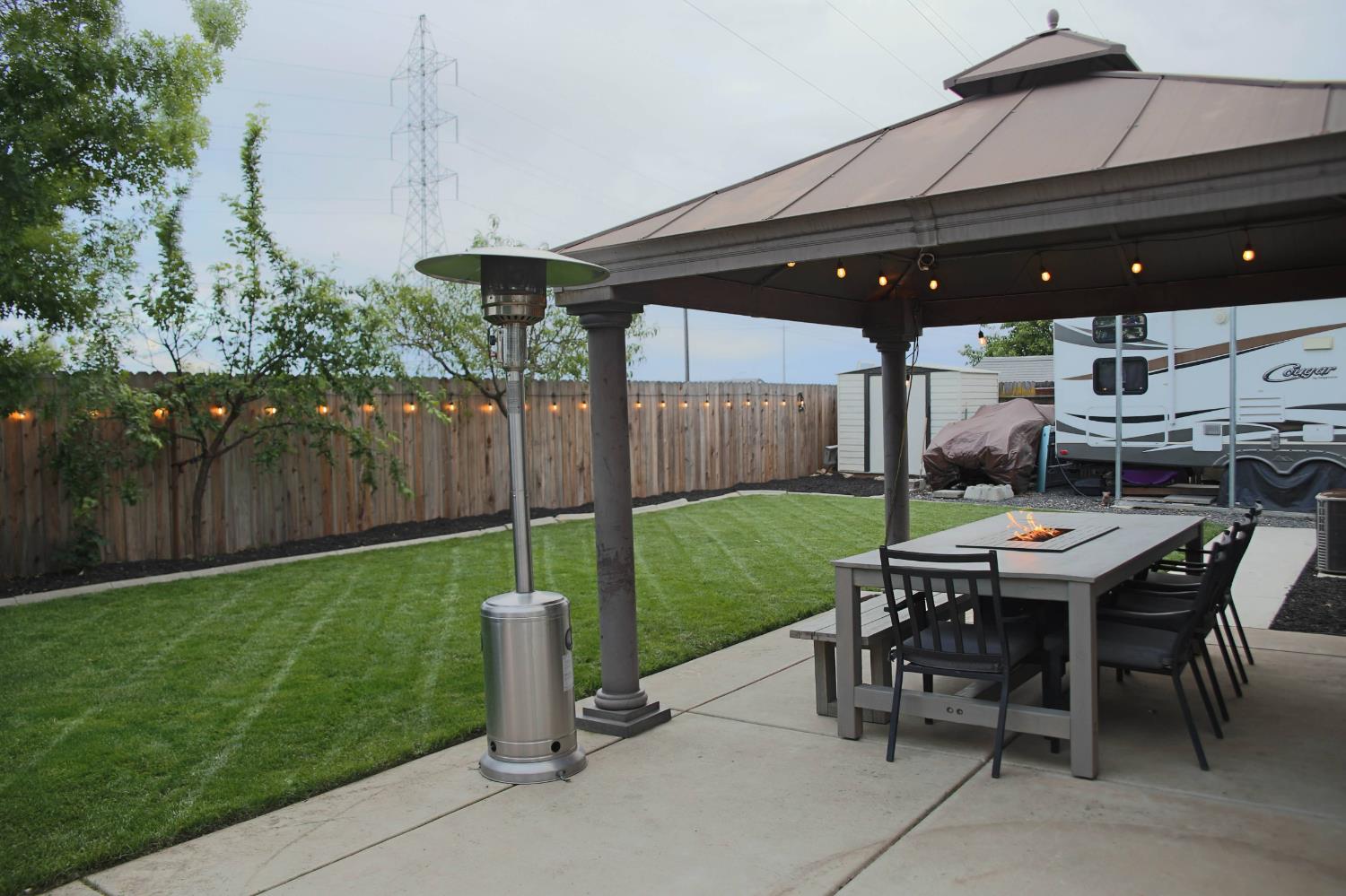 12372 Pawcatuck Way Rancho Cordova, CA 95742 - Photo 40 of 48 a dinning table and chairs in backyard of the house