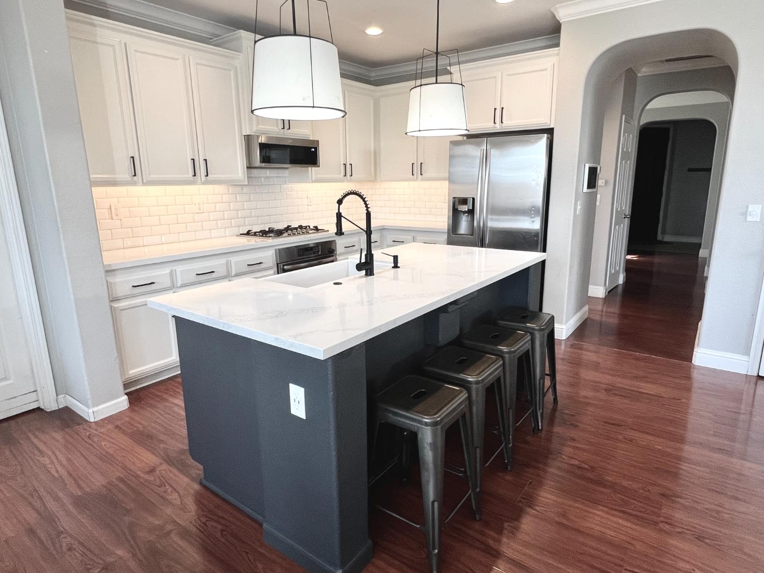 12372 Pawcatuck Way Rancho Cordova, CA 95742 - Photo 6 of 48 a kitchen with stainless steel appliances a stove a sink a refrigerator and a oven