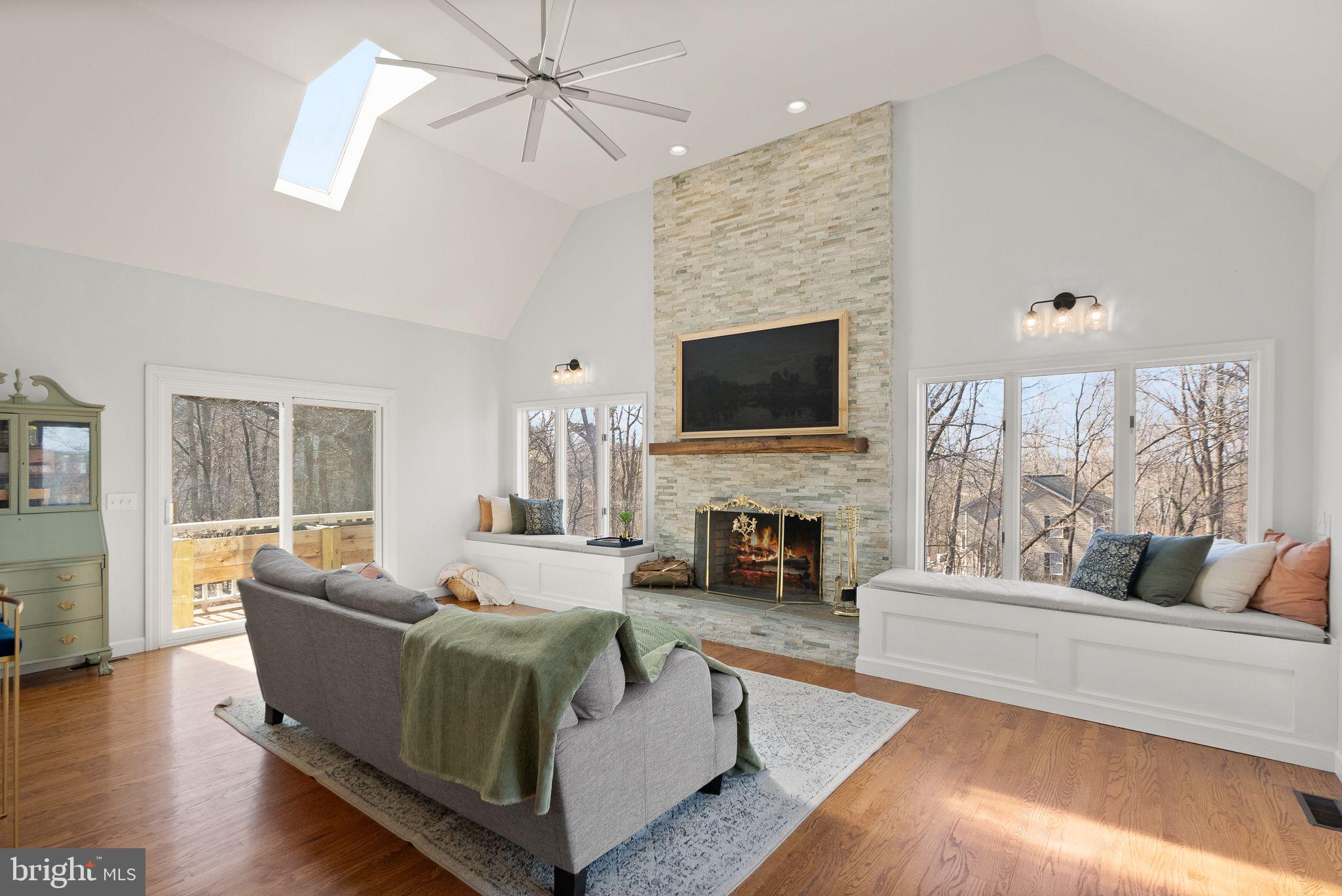 8089 Moormont Road Rapidan, VA 22733 - Photo 17 of 88 a living room with furniture a fireplace and a flat screen tv