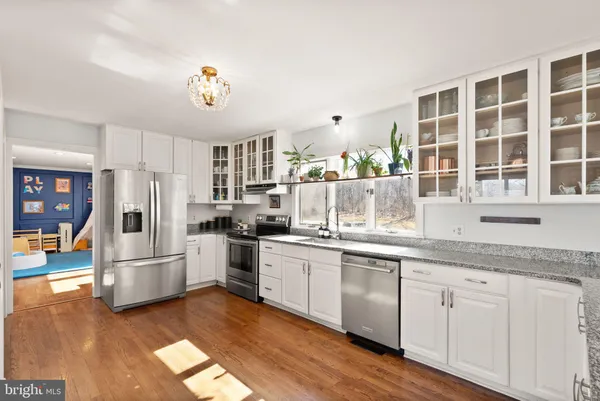 a white bath tub sitting next to a white sink