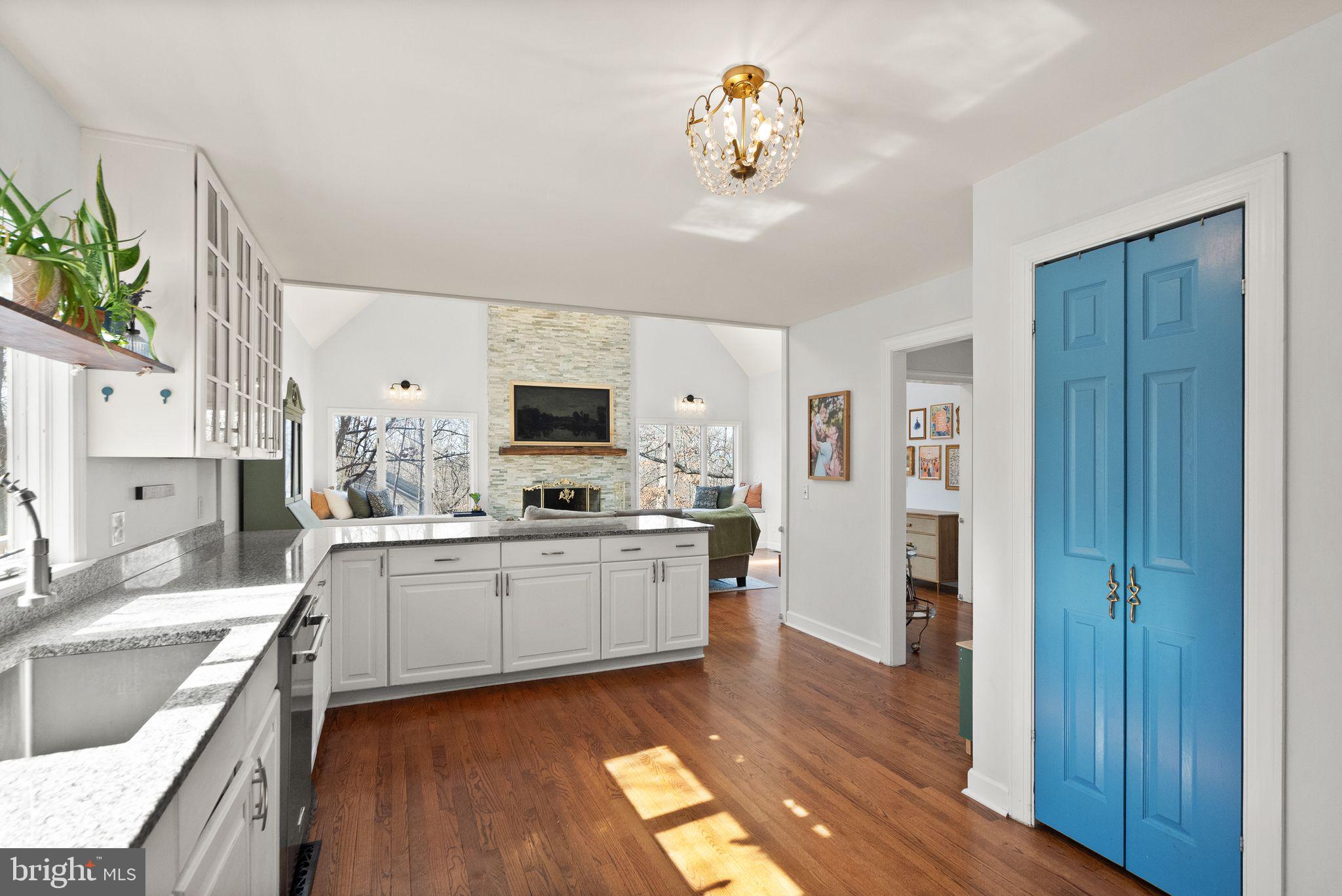 8089 Moormont Road Rapidan, VA 22733 - Photo 24 of 88 a kitchen with stainless steel appliances granite countertop a refrigerator a stove a sink dishwasher and white cabinets with wooden floor