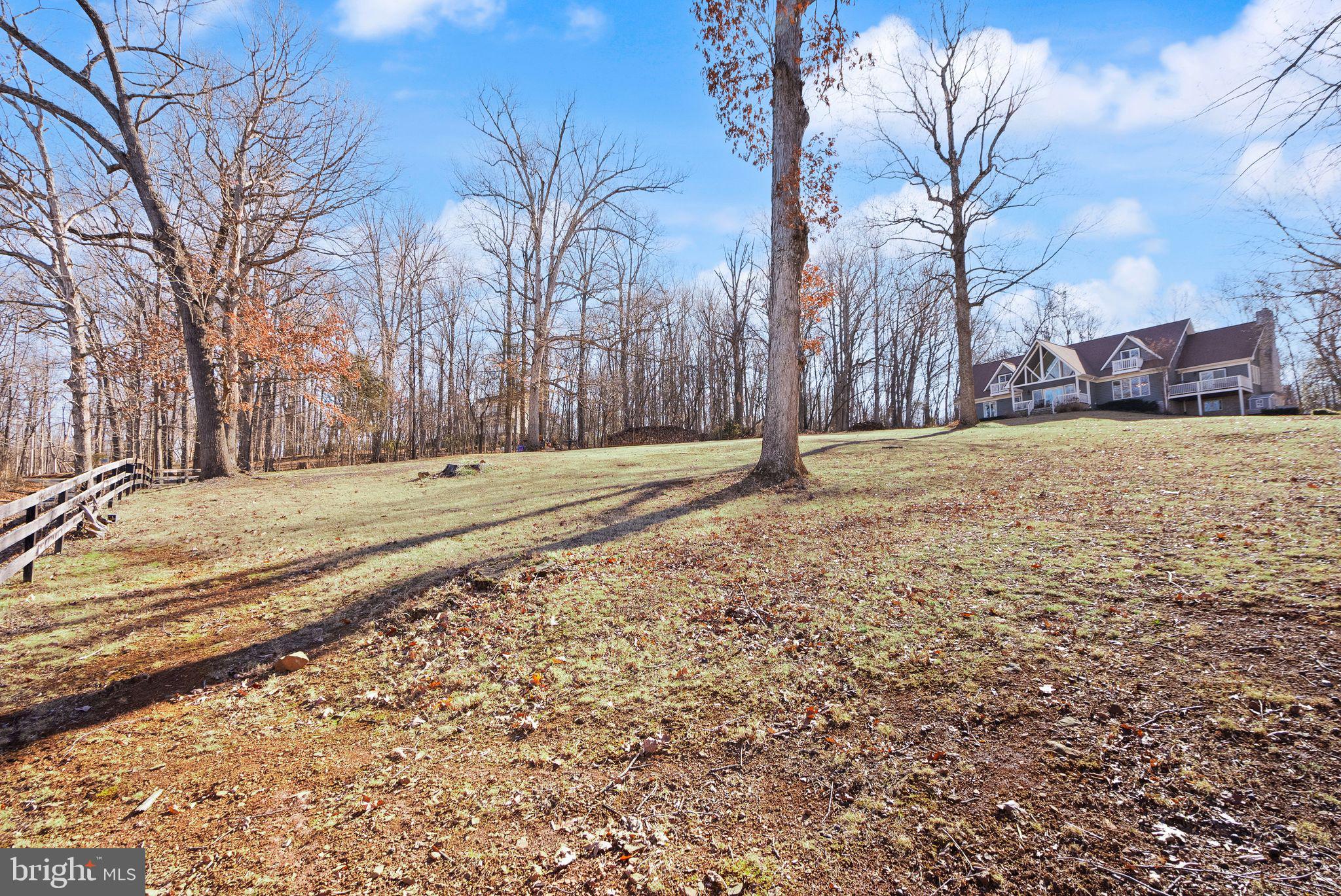 8089 Moormont Road Rapidan, VA 22733 - Photo 3 of 88 a view of a yard with wooden fence