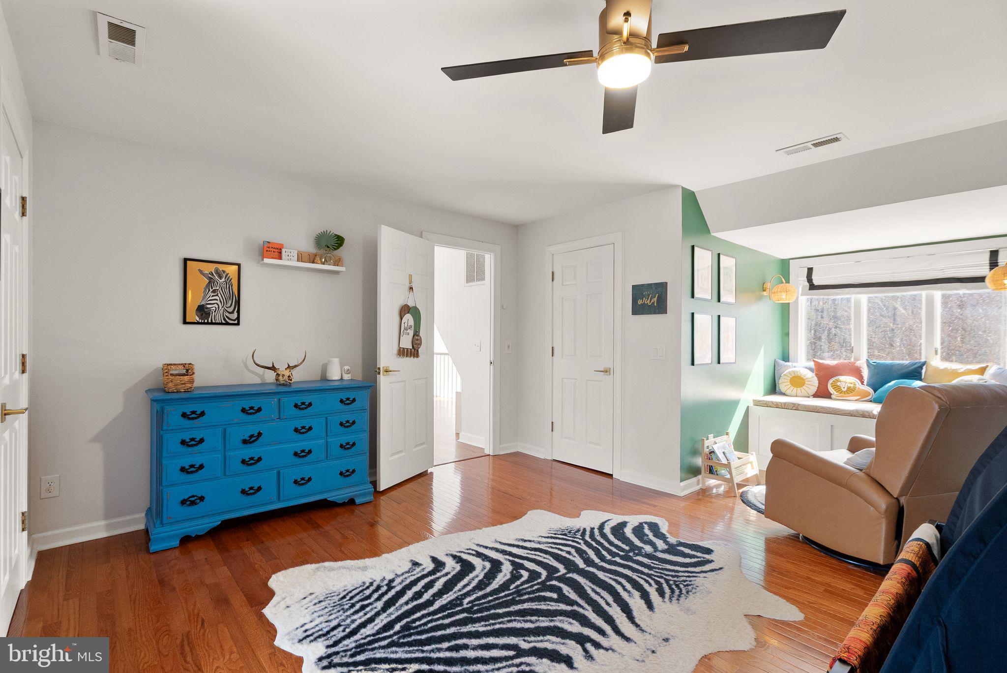 8089 Moormont Road Rapidan, VA 22733 - Photo 44 of 88 a bedroom with a bed and wooden floor