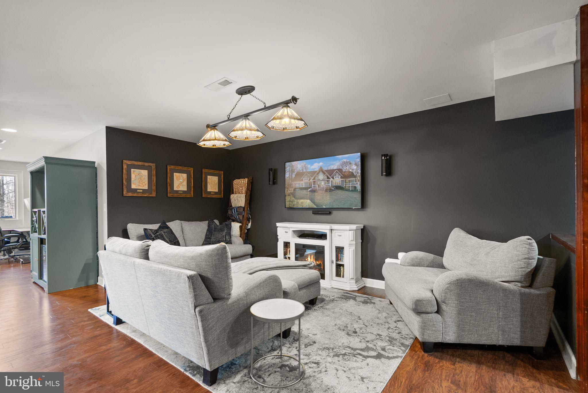 8089 Moormont Road Rapidan, VA 22733 - Photo 57 of 88 a living room with furniture and a flat screen tv