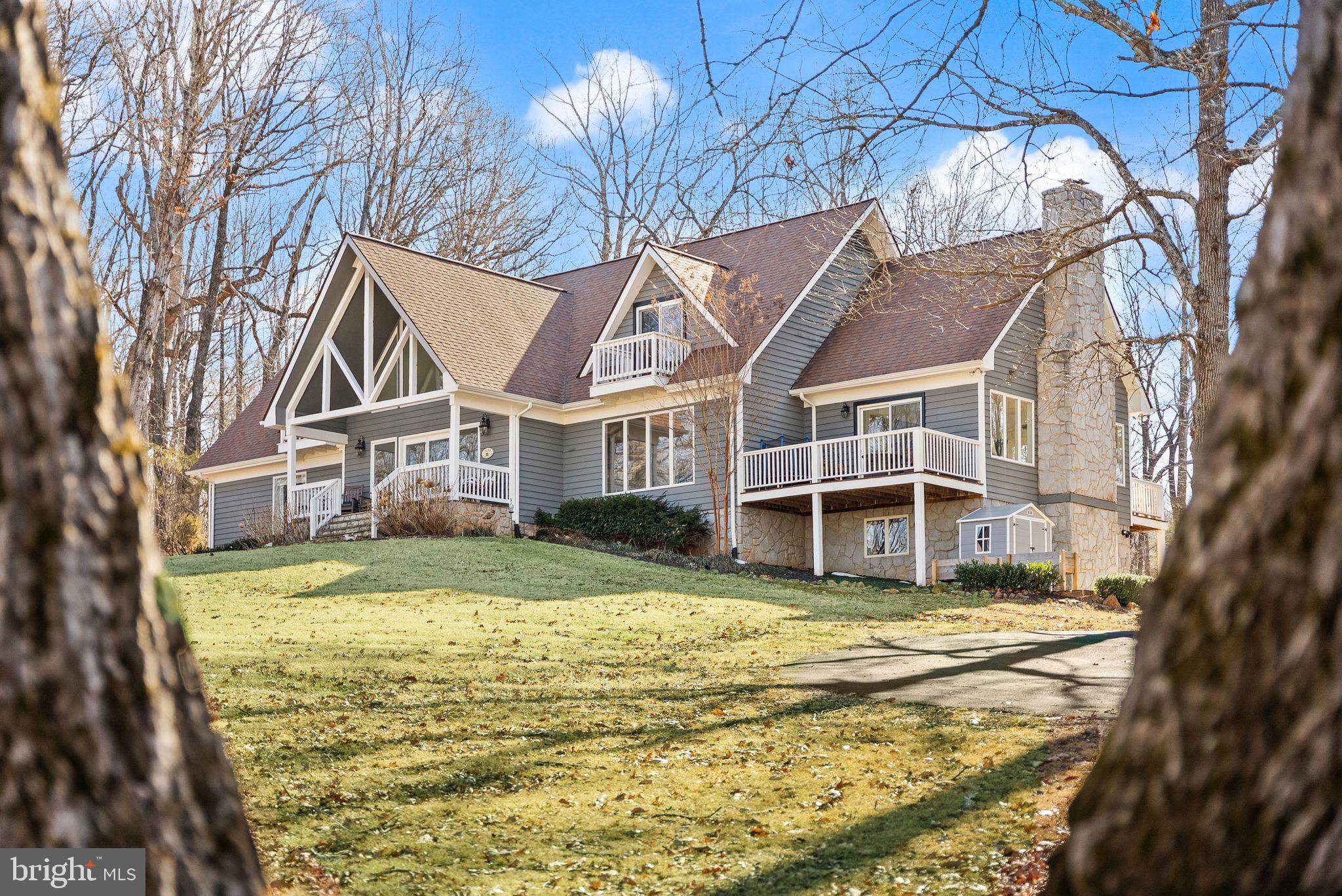8089 Moormont Road Rapidan, VA 22733 - Photo 7 of 88 a view of a house with a yard and sitting area