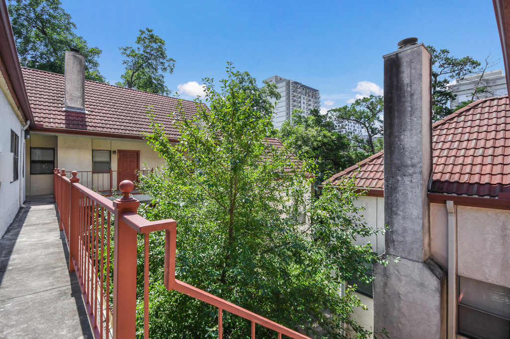 706 West 22nd Street, Unit 306 Austin, TX 78705 - Photo 2 of 19 a view of a house with iron fence