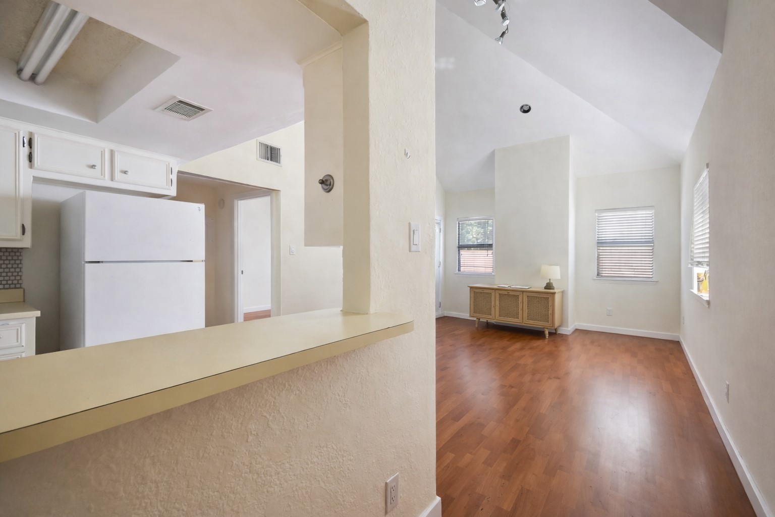706 West 22nd Street, Unit 306 Austin, TX 78705 - Photo 3 of 19 a view of a kitchen with a refrigerator and a sink