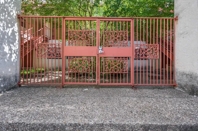 a view of a gate with a fence