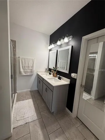 a kitchen with a refrigerator and sink