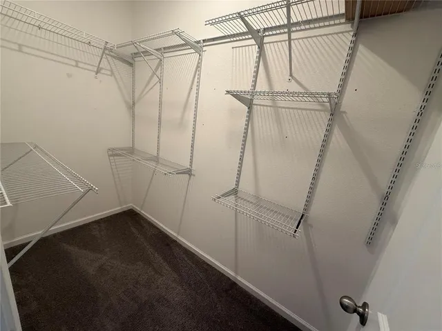 a view of a room with racks on the wall