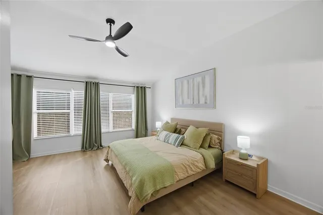 a bedroom with a bed and a chandelier