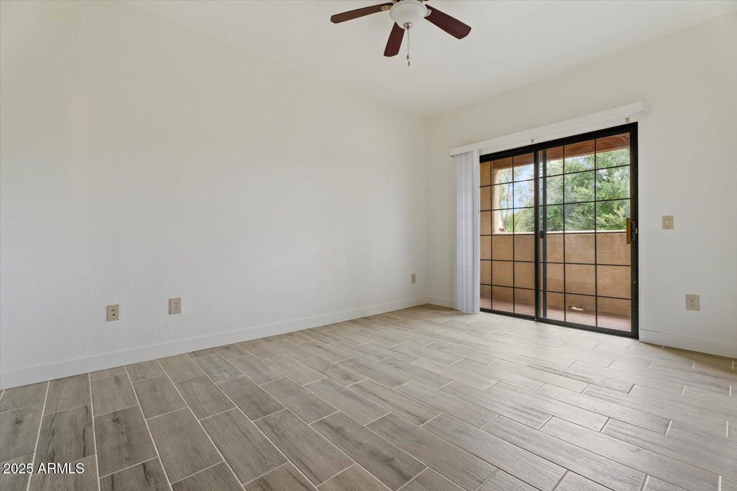 3434 East Baseline Road, Unit 260 Phoenix, AZ 85042 - Photo 12 of 19 wooden floor in an empty room with a window