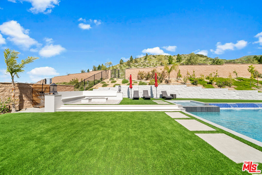 12553 Ridgeline Road Porter Ranch, CA 91326 - Photo 12 of 53 a view of swimming pool with outdoor seating and city view