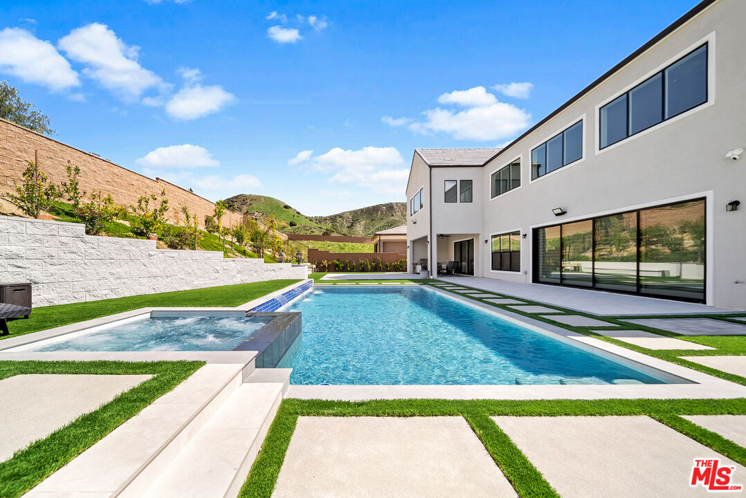 12553 Ridgeline Road Porter Ranch, CA 91326 - Photo 14 of 53 a view of a house with a yard