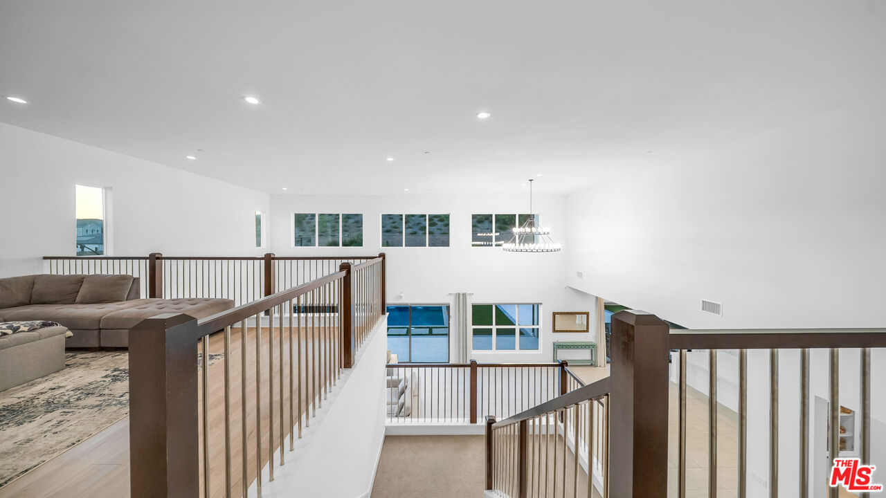 12553 Ridgeline Road Porter Ranch, CA 91326 - Photo 33 of 53 a view of a hallway with seating area