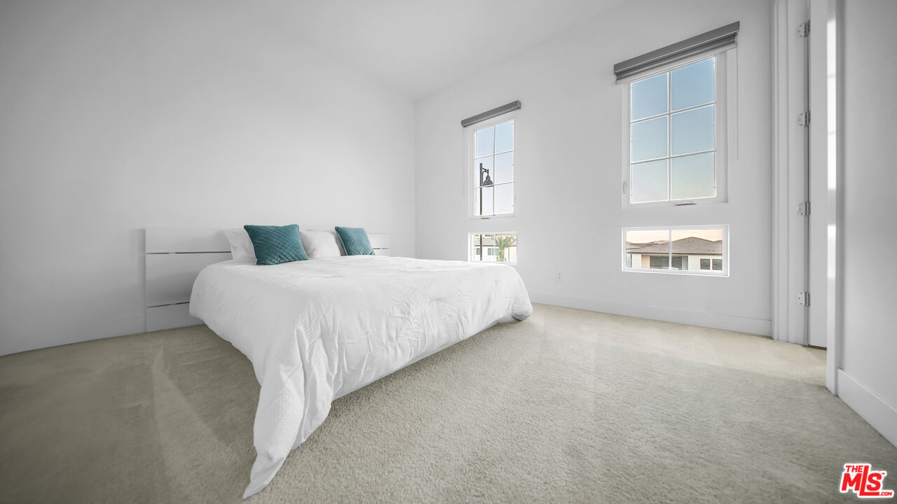 12553 Ridgeline Road Porter Ranch, CA 91326 - Photo 39 of 53 a bedroom with a bed and a window