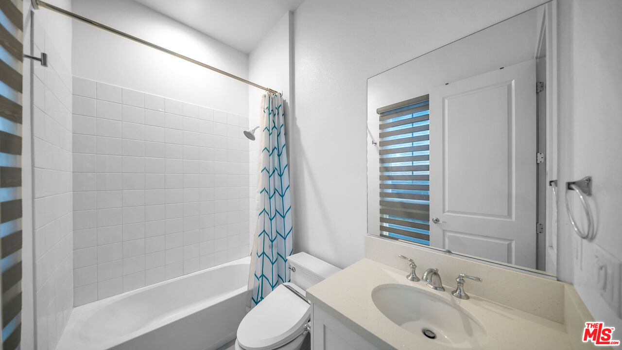 12553 Ridgeline Road Porter Ranch, CA 91326 - Photo 40 of 53 a bathroom with a sink toilet and shower