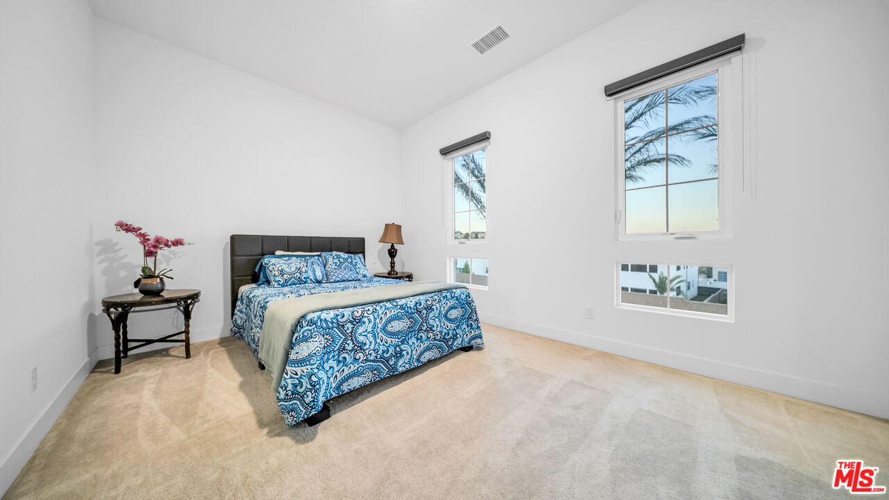 12553 Ridgeline Road Porter Ranch, CA 91326 - Photo 44 of 53 a bedroom with a bed and a window