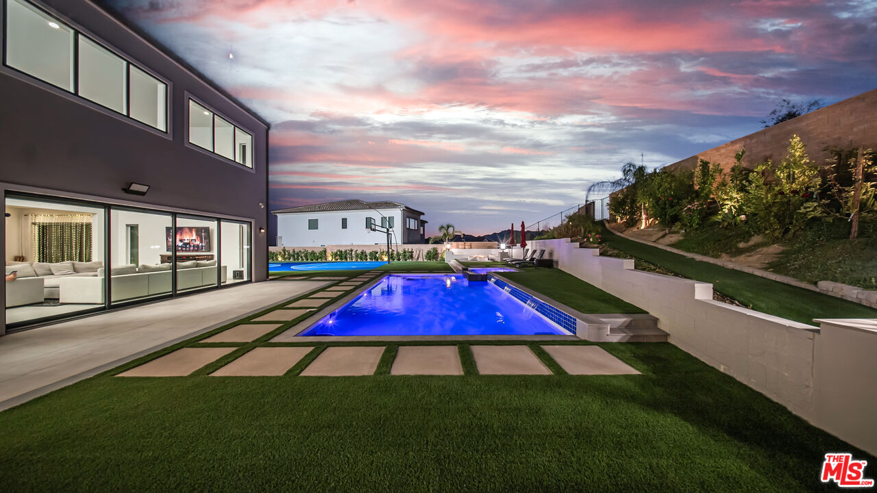 12553 Ridgeline Road Porter Ranch, CA 91326 - Photo 48 of 53 a view of outdoor space with pool and furniture