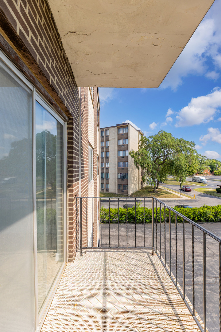 9820 South Pulaski Road, Unit 213 Oak Lawn, IL 60453 - Photo 13 of 15 a view of a building from a balcony