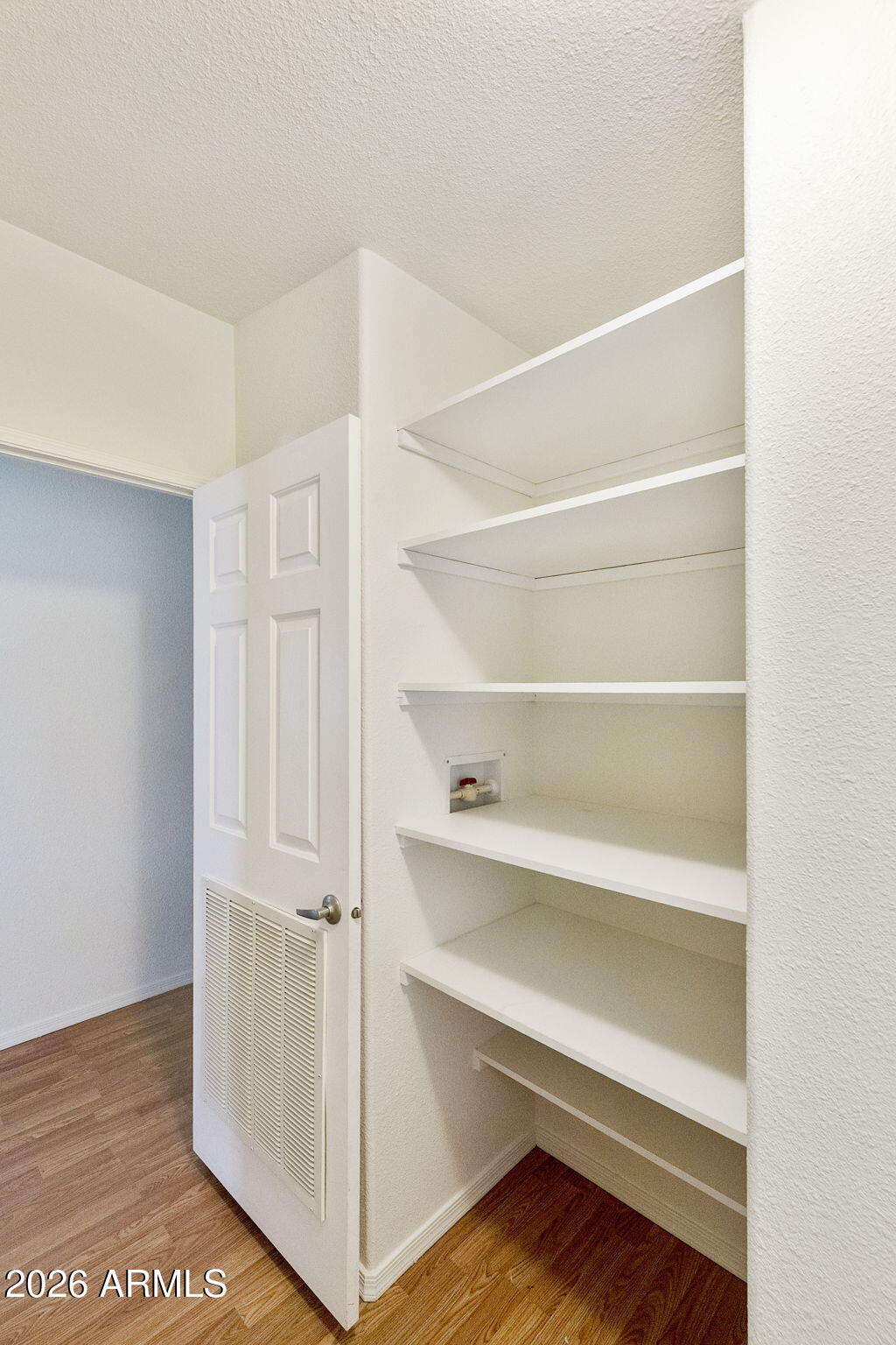 3700 South Tomahawk Road, Unit 93 Apache Junction, AZ 85119 - Photo 12 of 32 a view of walk in closet with empty racks