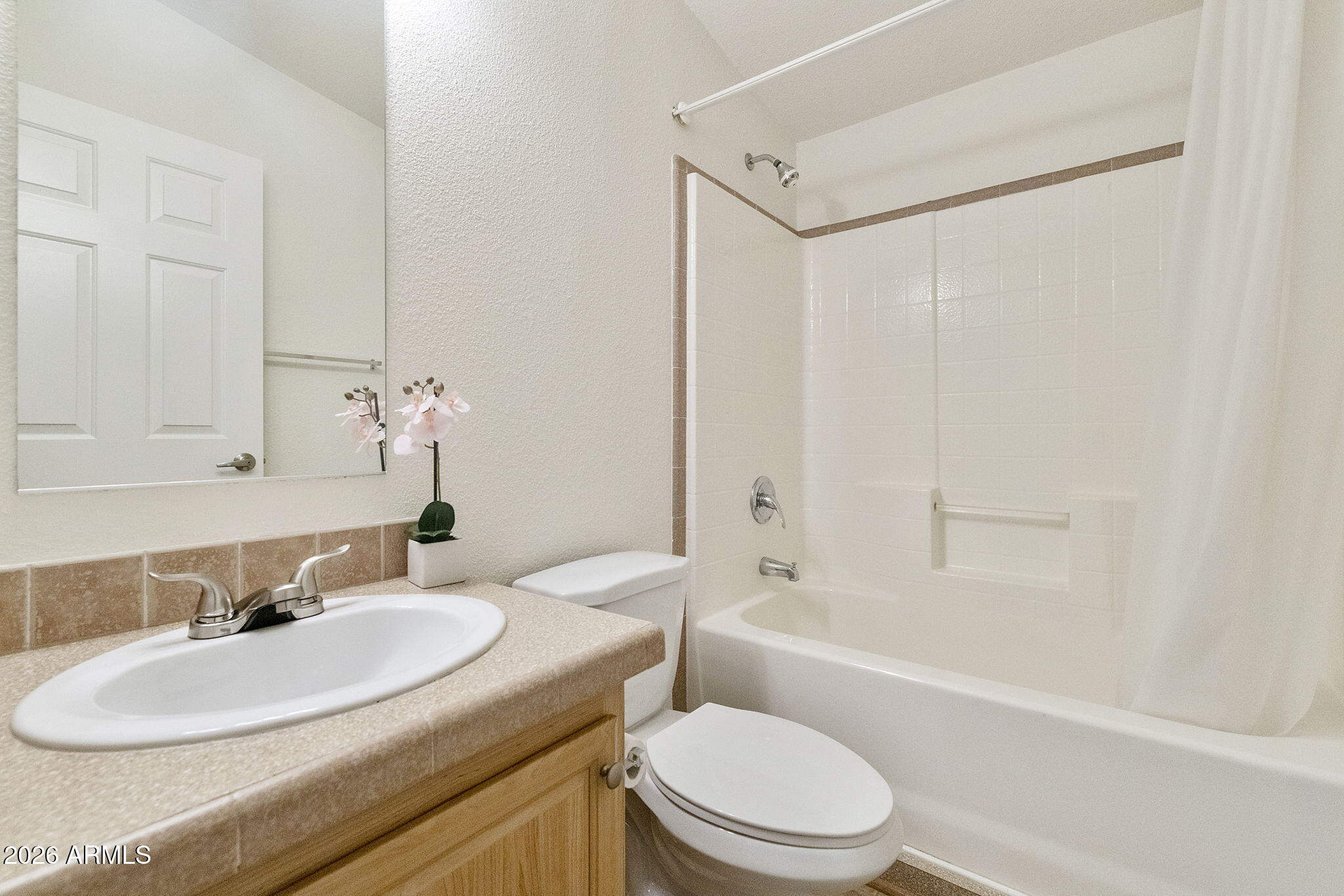 3700 South Tomahawk Road, Unit 93 Apache Junction, AZ 85119 - Photo 17 of 32 a bathroom with a sink toilet and shower
