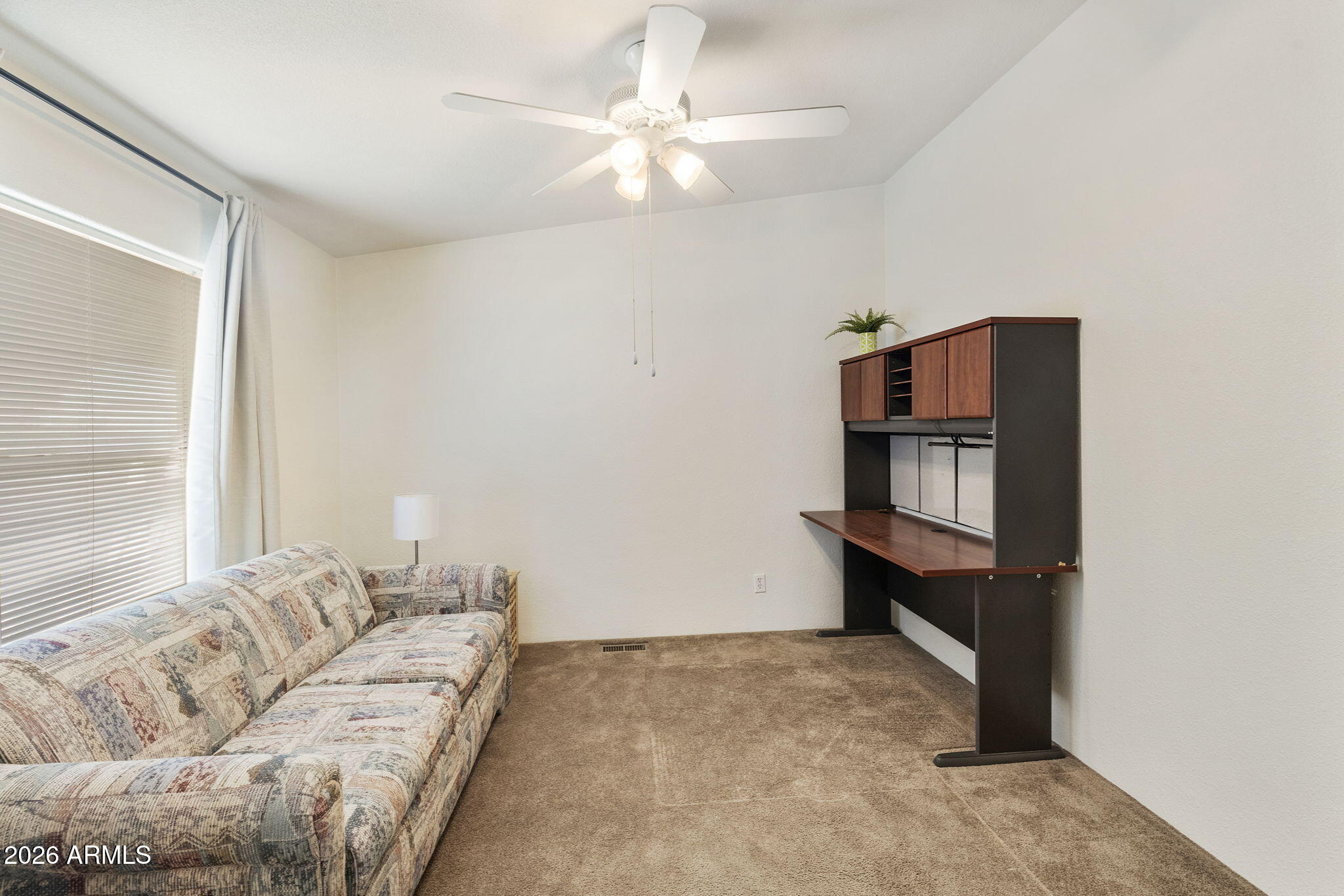 3700 South Tomahawk Road, Unit 93 Apache Junction, AZ 85119 - Photo 30 of 32 a living room with furniture and a window