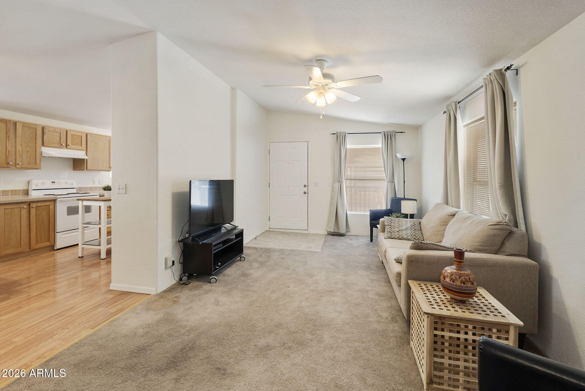 3700 South Tomahawk Road, Unit 93 Apache Junction, AZ 85119 - Photo 31 of 32 a living room with furniture and a flat screen tv