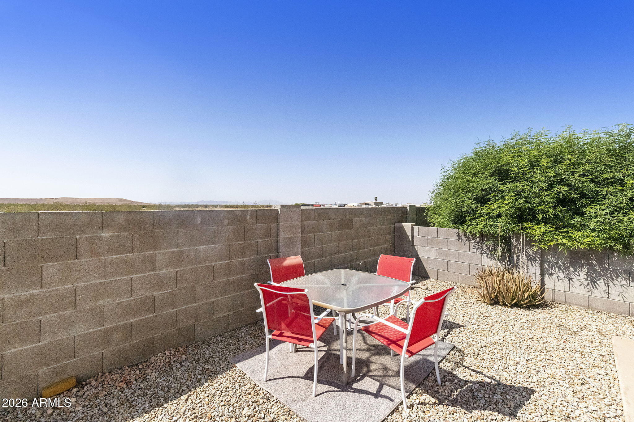 3700 South Tomahawk Road, Unit 93 Apache Junction, AZ 85119 - Photo 8 of 32 a patio with water view of a yard