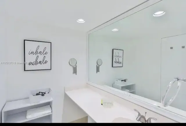 a bathroom with a tub and sink