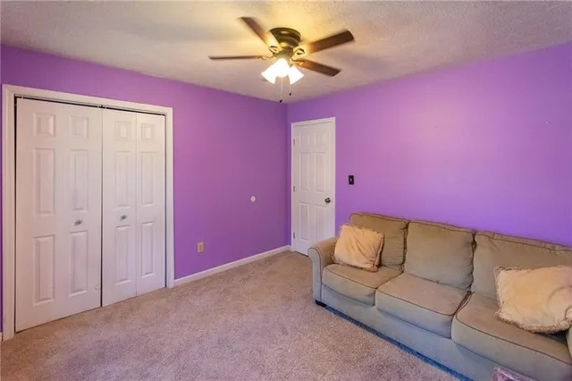 a view of entryway livingroom and hall with wooden floor
