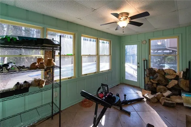 a view of balcony with wooden floor and outdoor seating