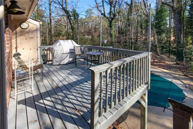 a balcony with table and chairs