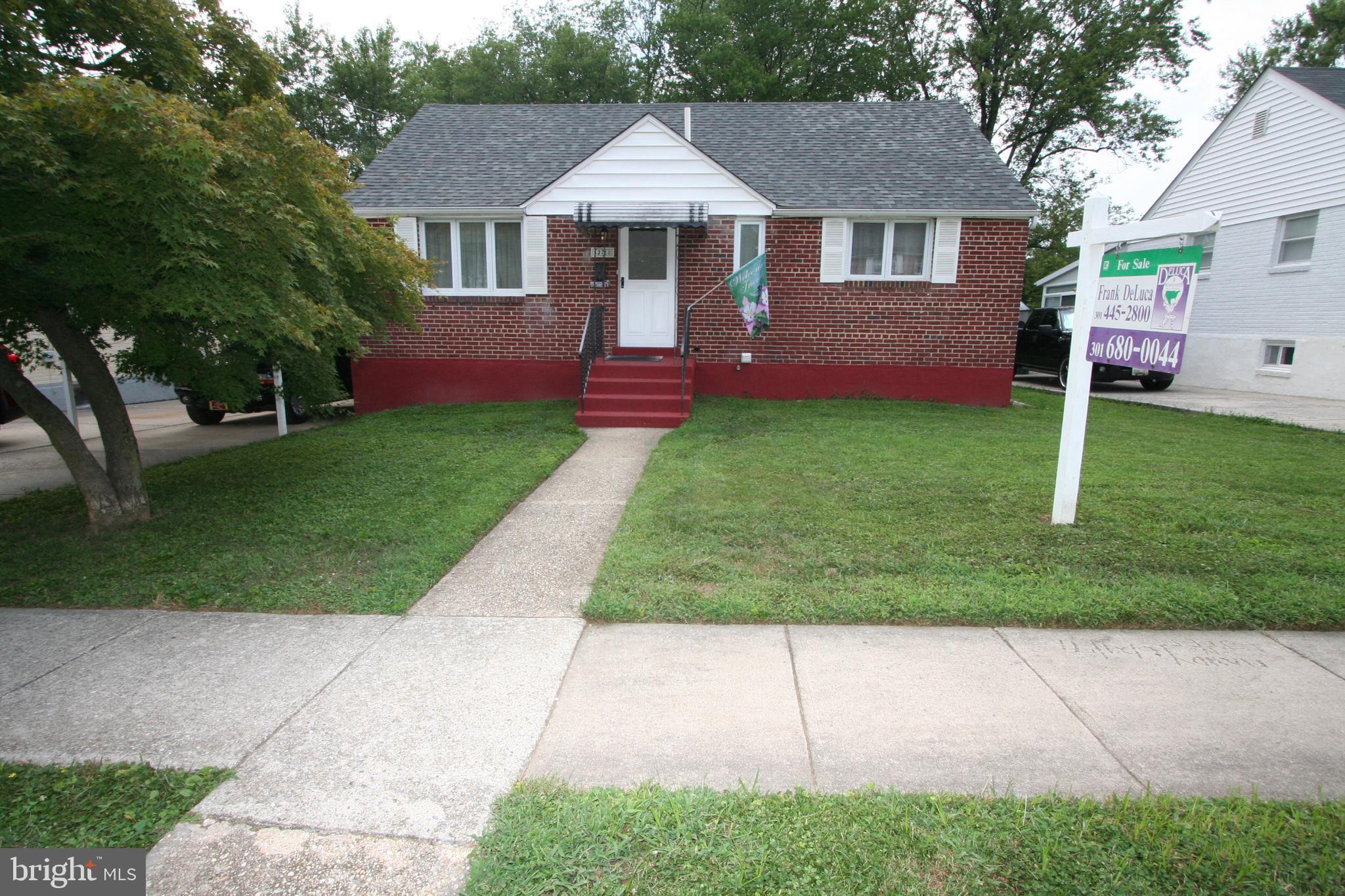12718 Gould Road Silver Spring, MD 20906 - Photo 2 of 55 front view of a house with a yard