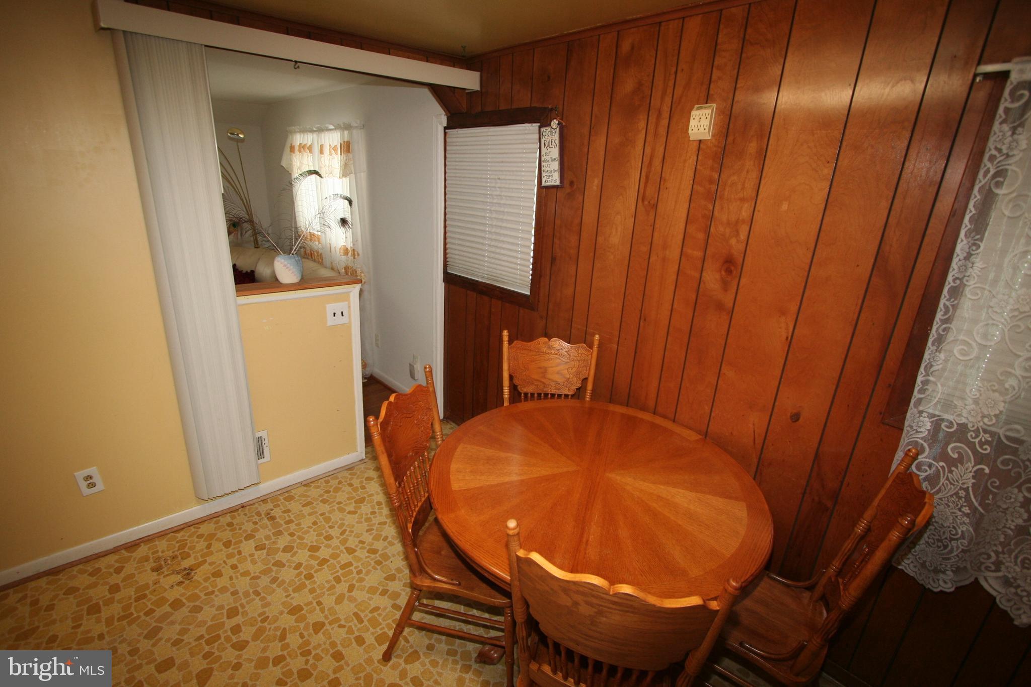 12718 Gould Road Silver Spring, MD 20906 - Photo 15 of 55 a view of table and chair