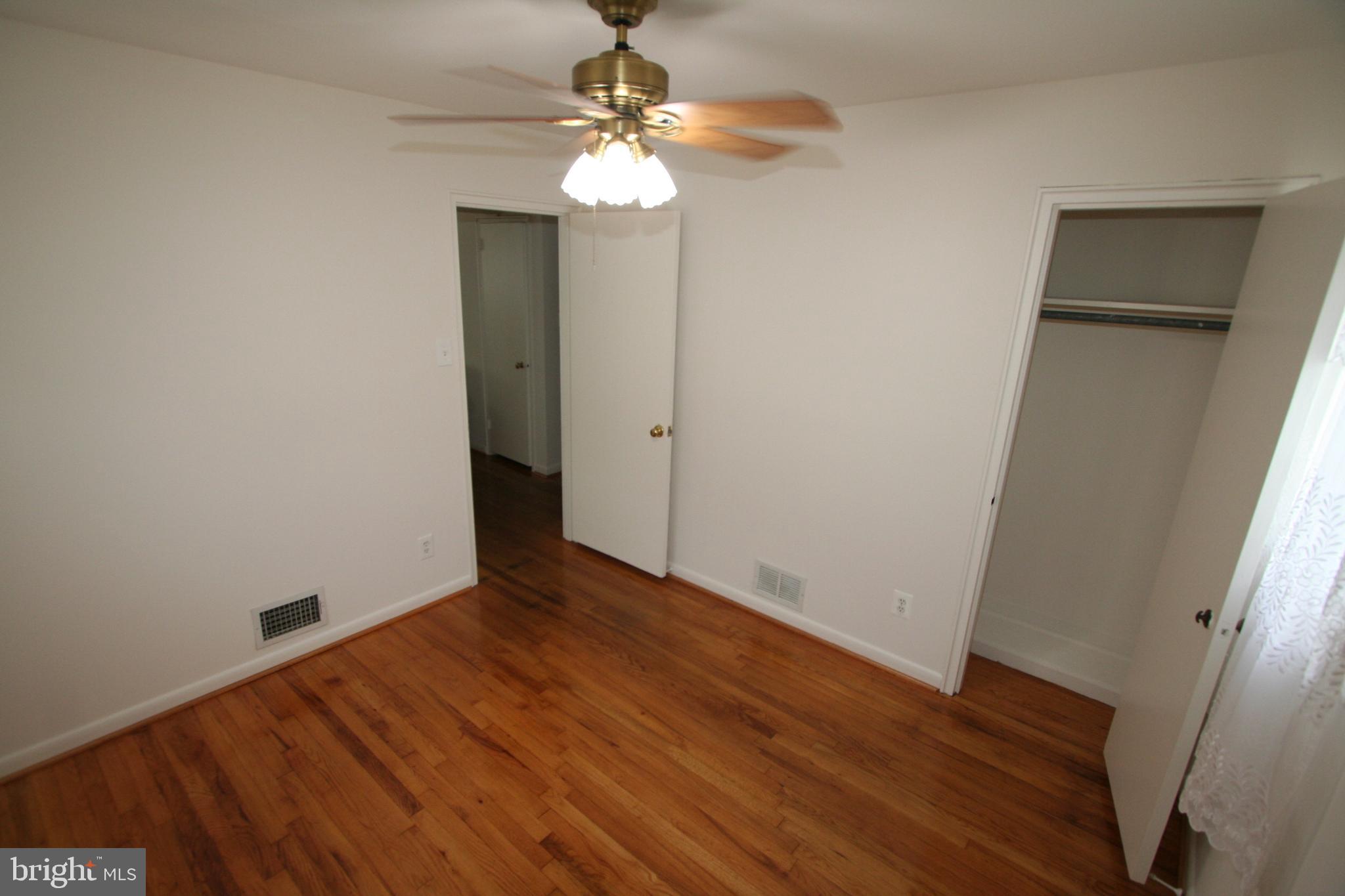 12718 Gould Road Silver Spring, MD 20906 - Photo 20 of 55 wooden floor in an empty room with a window