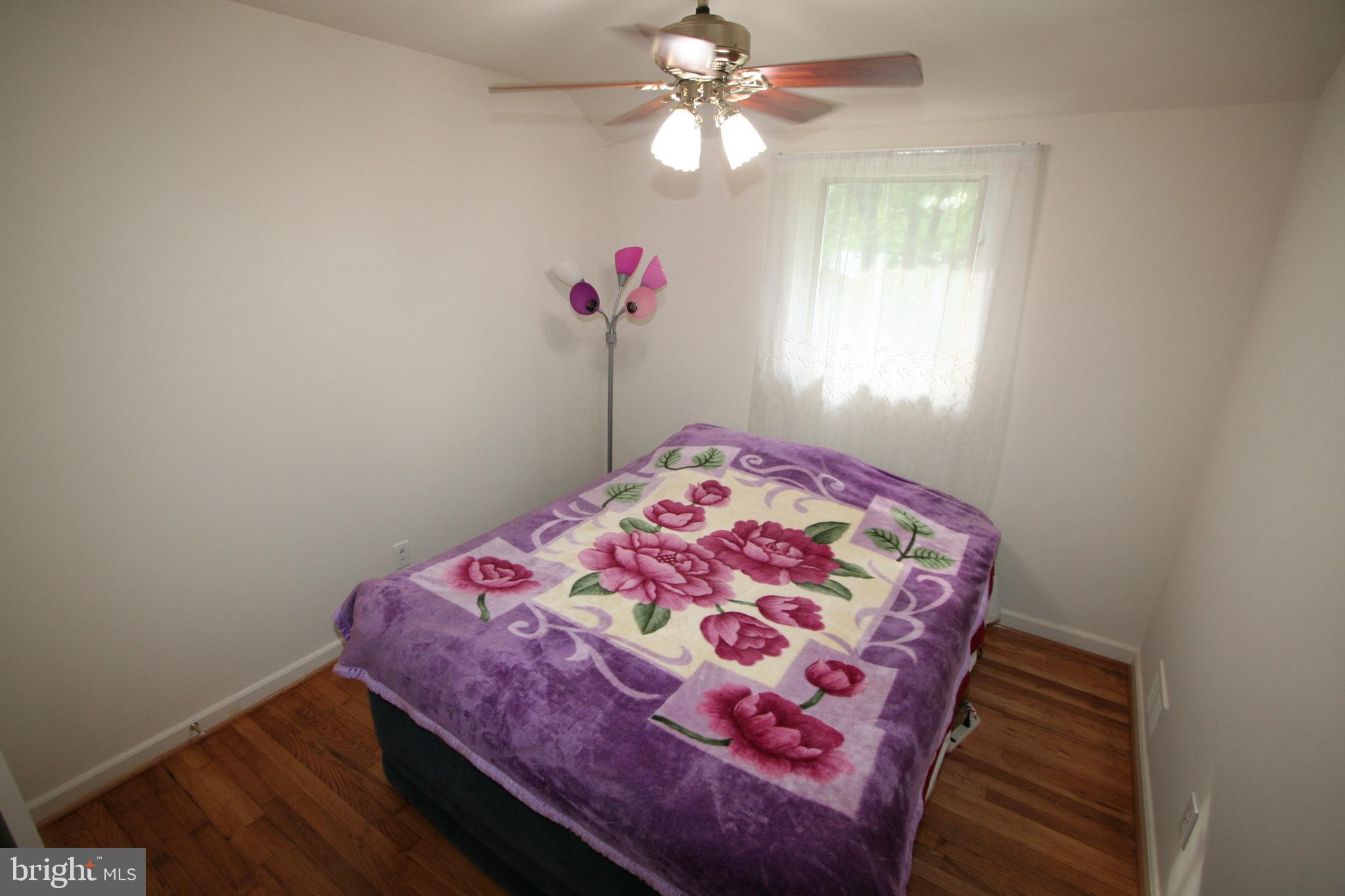12718 Gould Road Silver Spring, MD 20906 - Photo 21 of 55 a bedroom with a bed and a window