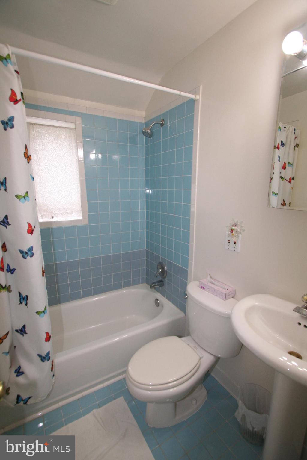 12718 Gould Road Silver Spring, MD 20906 - Photo 25 of 55 a white toilet sitting next to a bath tub