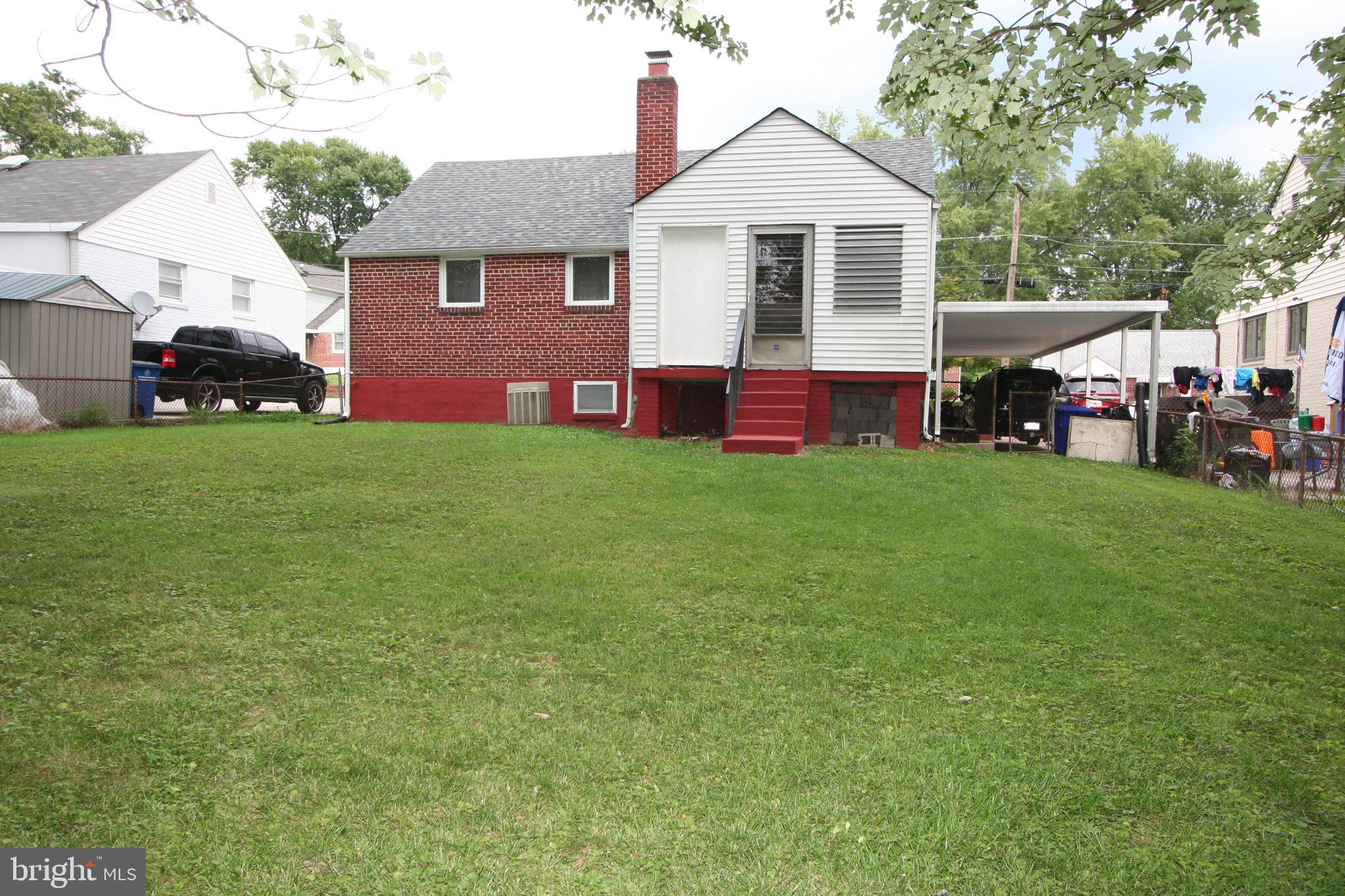 12718 Gould Road Silver Spring, MD 20906 - Photo 4 of 55 a view of a yard in front of a house with large trees