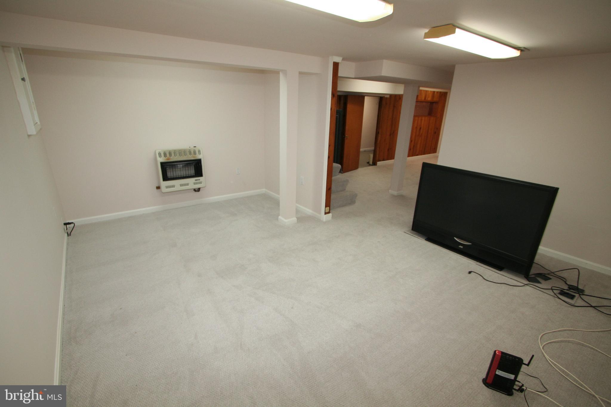 12718 Gould Road Silver Spring, MD 20906 - Photo 31 of 55 a view of an empty room with workspace and mirror
