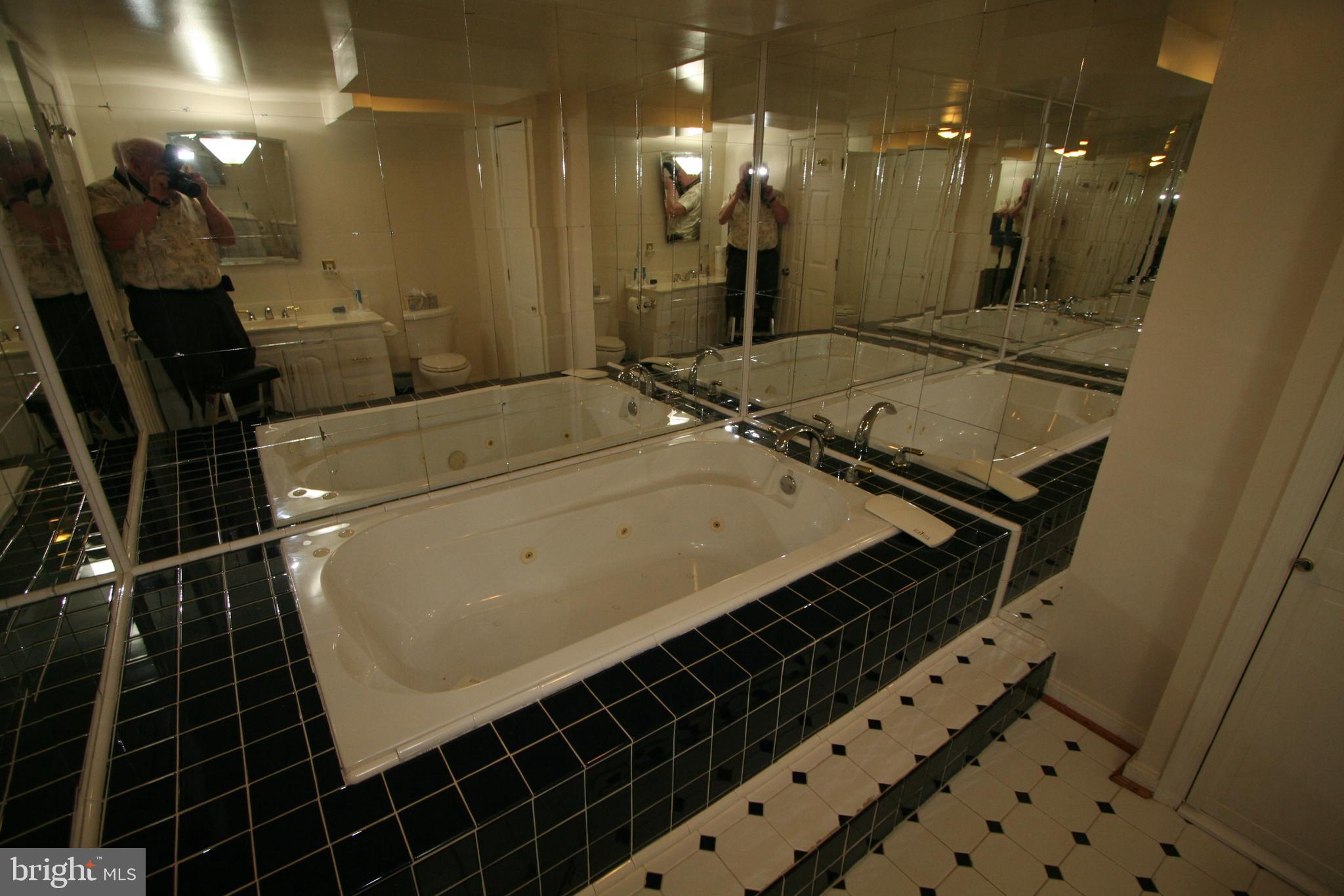 12718 Gould Road Silver Spring, MD 20906 - Photo 35 of 55 a bathroom with a granite countertop sink a toilet and a mirror