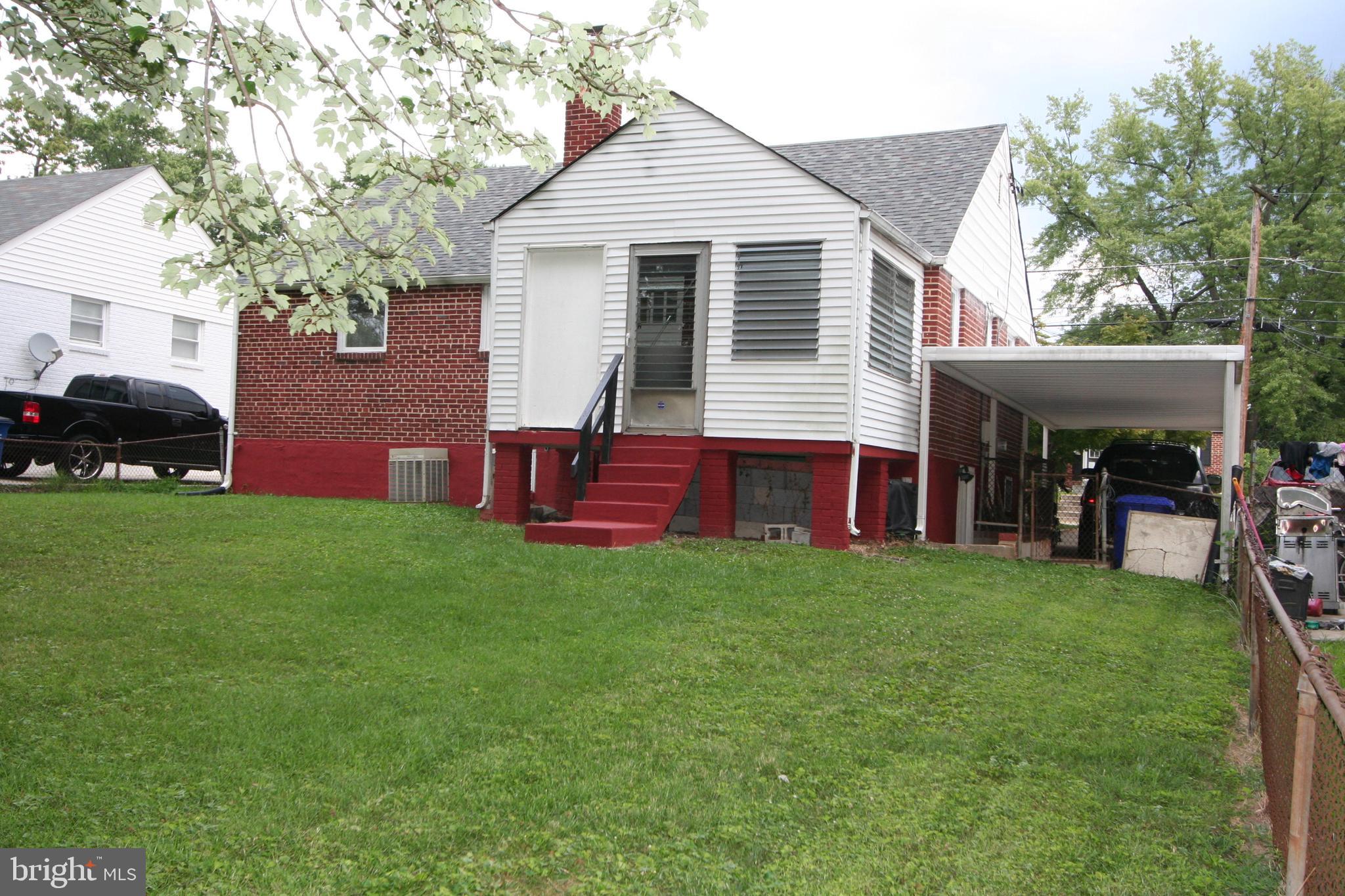 12718 Gould Road Silver Spring, MD 20906 - Photo 5 of 55 a front view of a house with a garden and porch