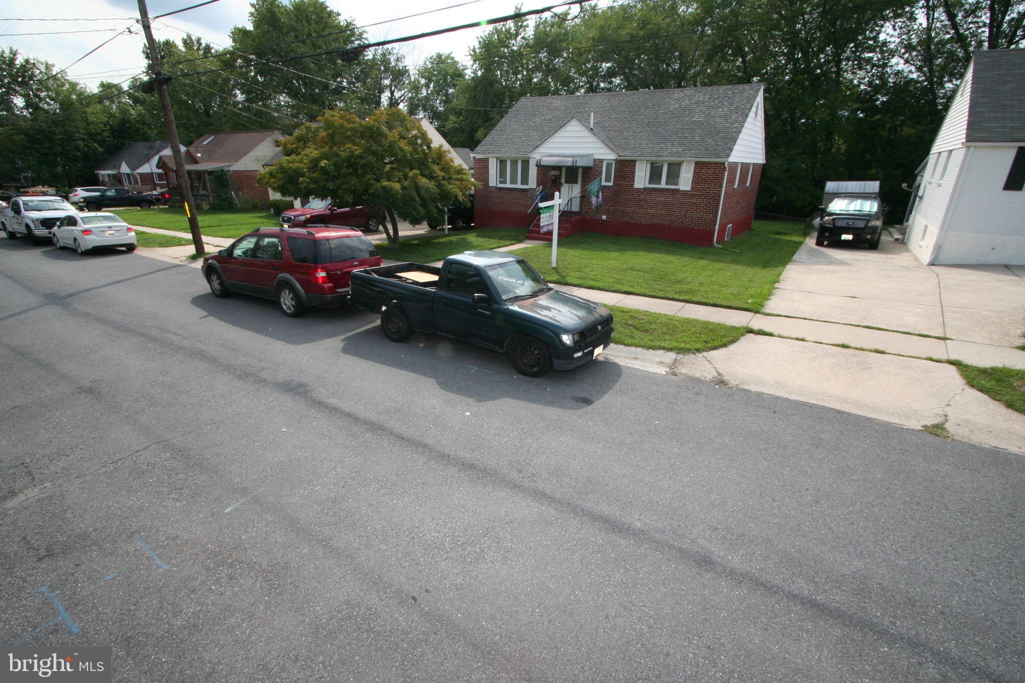 12718 Gould Road Silver Spring, MD 20906 - Photo 45 of 55 a view of a street with cars parked