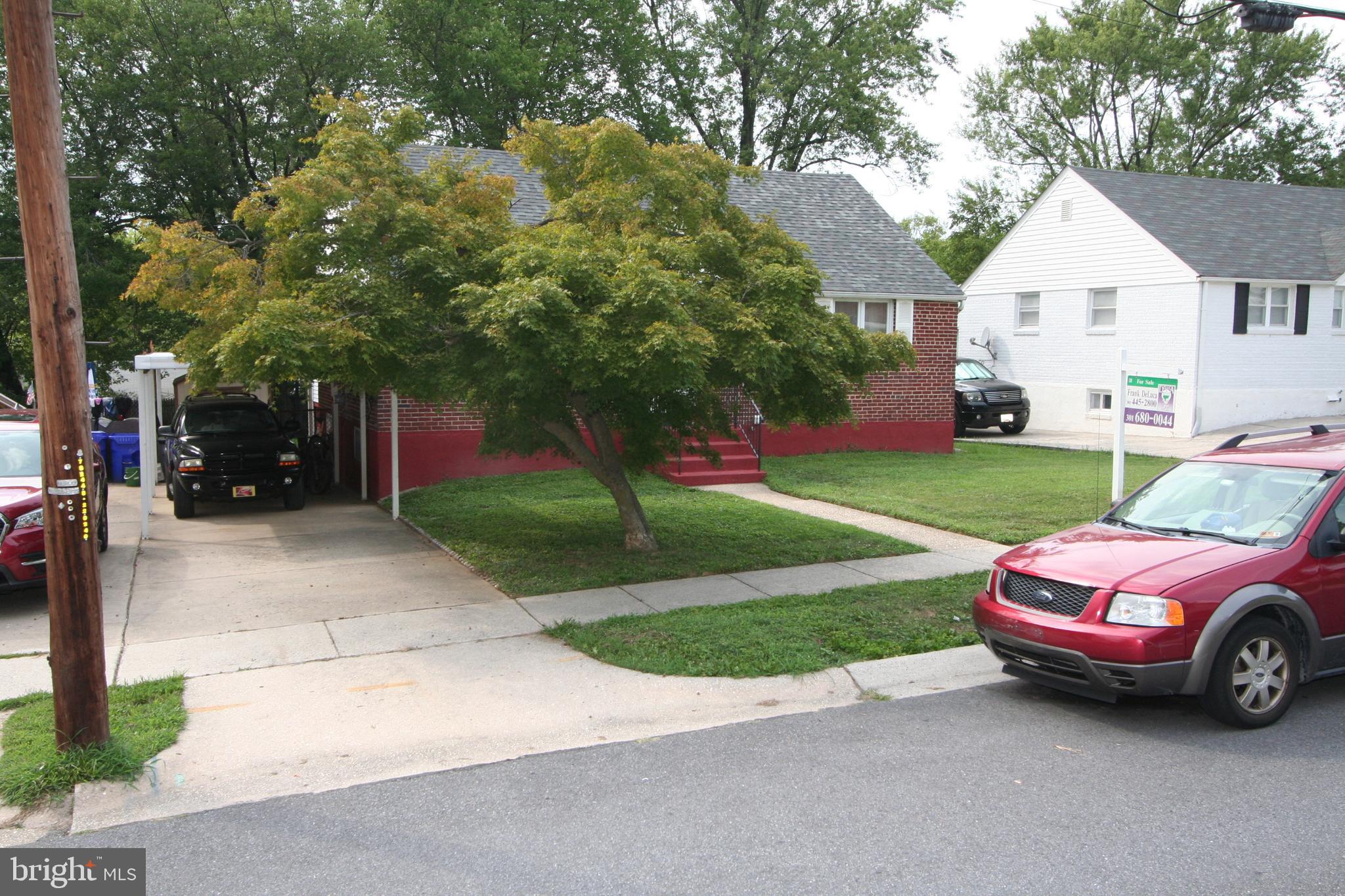 12718 Gould Road Silver Spring, MD 20906 - Photo 47 of 55 a front view of a house with garden