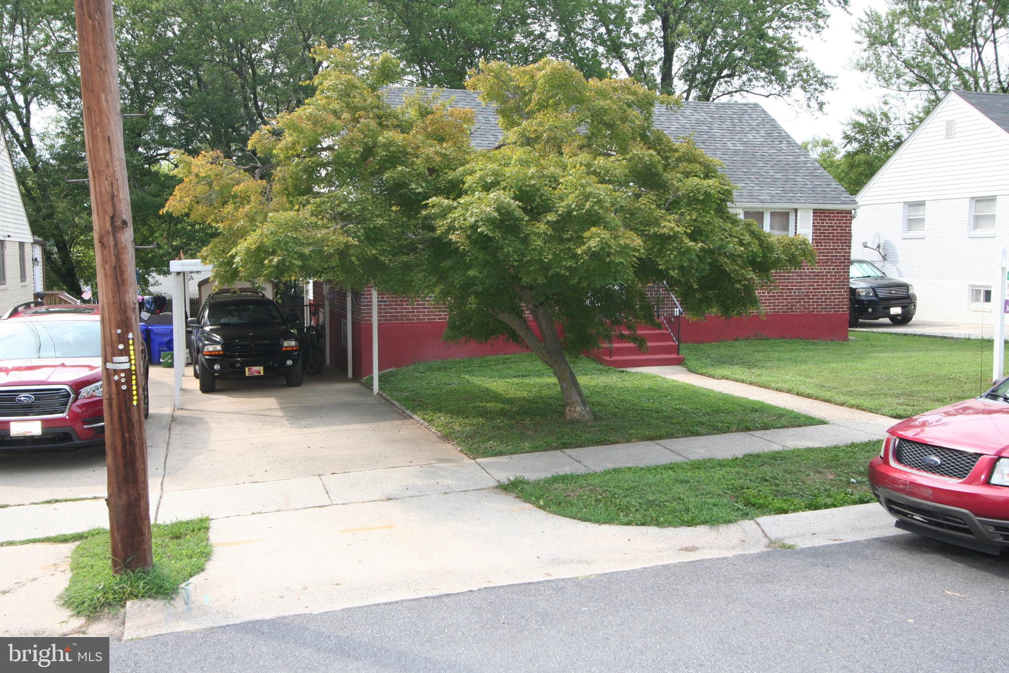 12718 Gould Road Silver Spring, MD 20906 - Photo 48 of 55 a view of a street with cars parked