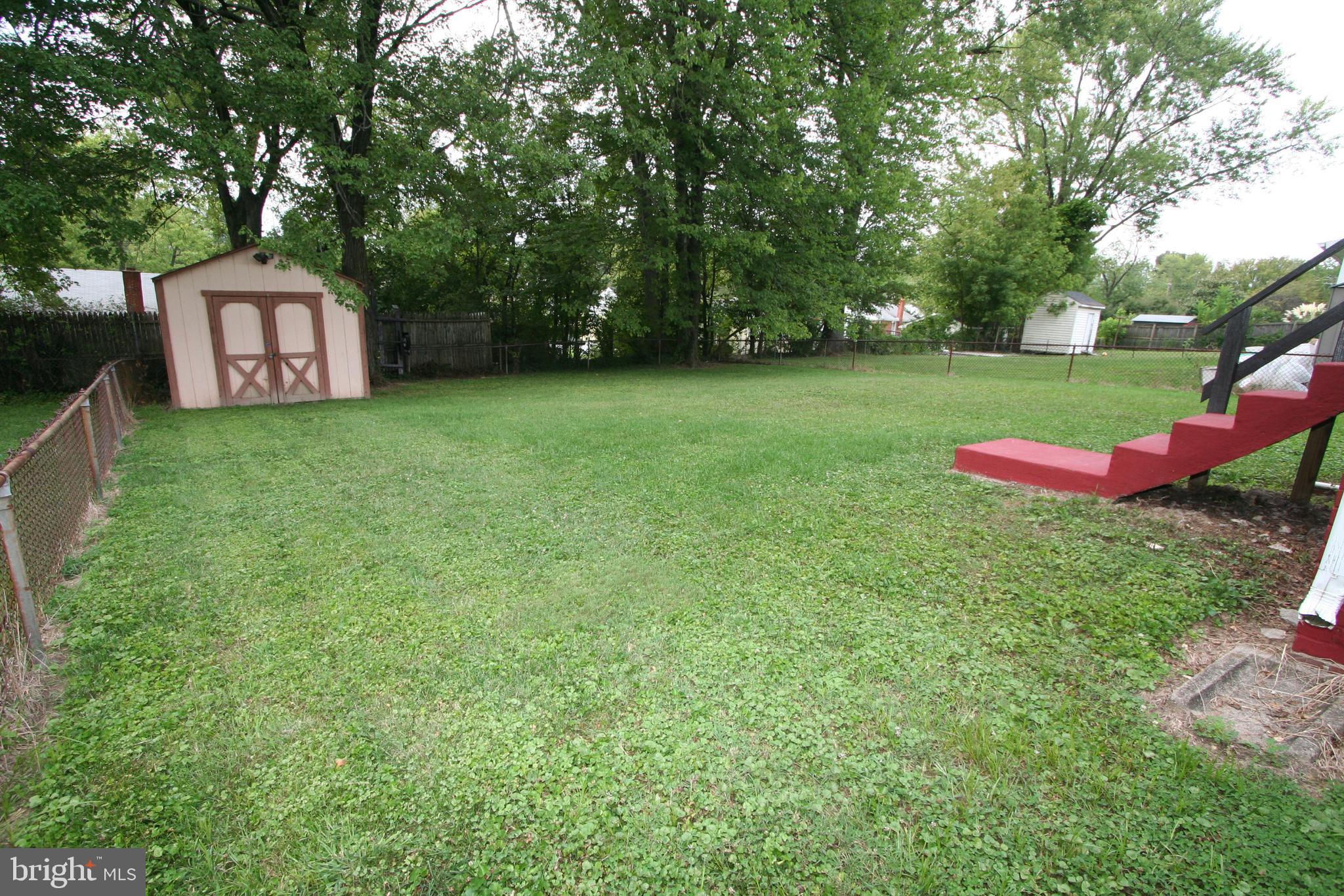 12718 Gould Road Silver Spring, MD 20906 - Photo 6 of 55 a view of a backyard with a garden and entertaining space