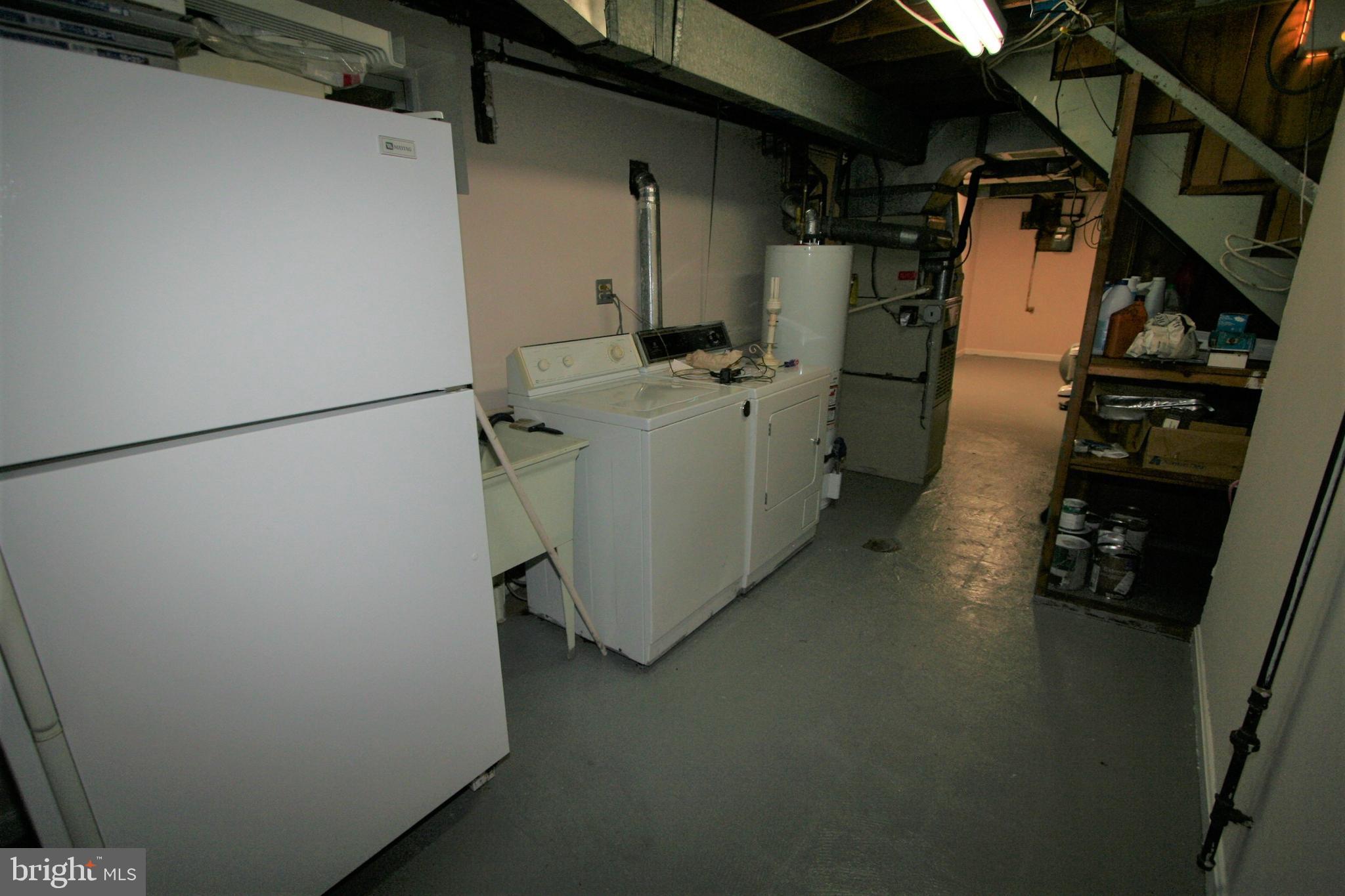 12718 Gould Road Silver Spring, MD 20906 - Photo 54 of 55 a utility room with dryer and washer
