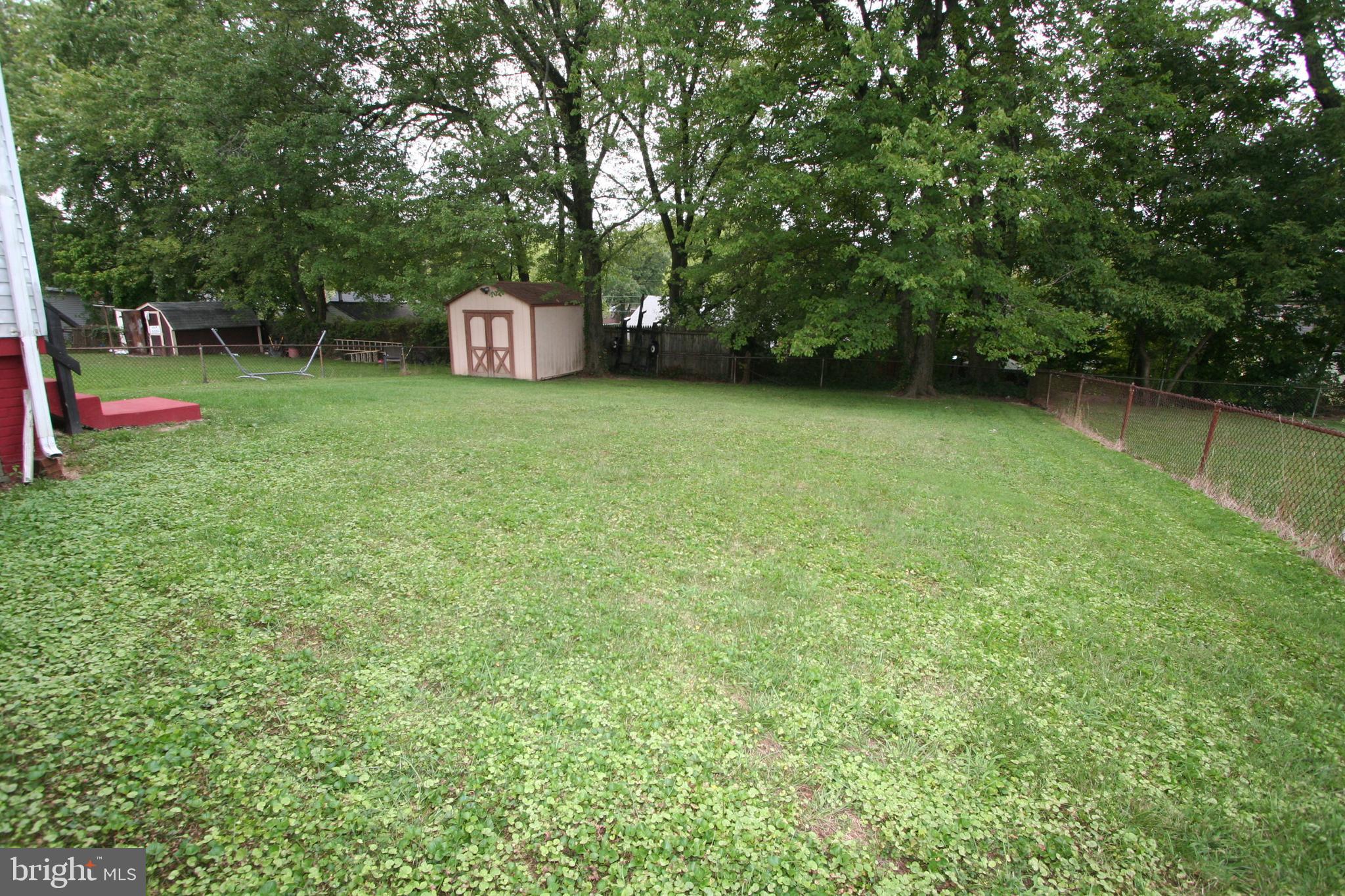 12718 Gould Road Silver Spring, MD 20906 - Photo 7 of 55 a view of a green field with trees in the background