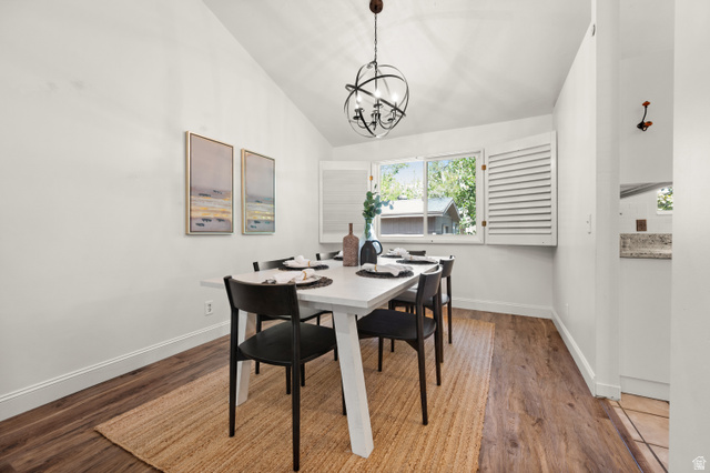 2163 Borg Drive Sandy, UT 84092 - Photo 5 of 31 Dining room featuring lofted ceiling, wood finished floors, and hanging lights
