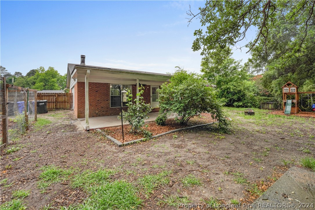 6481 Green Meadow Road Fayetteville, NC 28304 - Photo 11 of 33 a view of a house with backyard